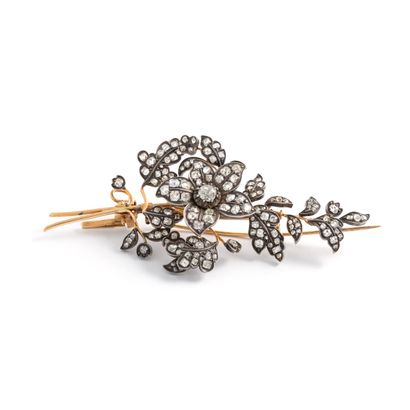 null 18K yellow gold 750‰ and silver 2nd title 800‰ brooch, in the form of a leafy...