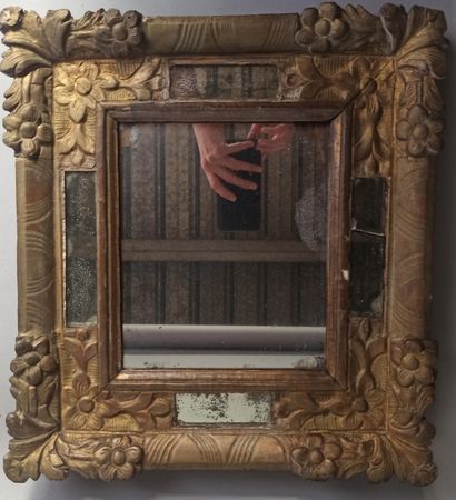 Mirror with parecloses in a gilded wood frame...