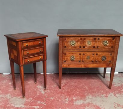 null Wood and veneer chest of drawers opening to two drawers with inlaid decoration...