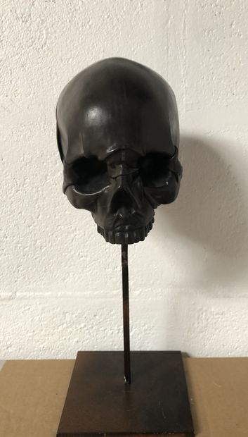 Leather skull on wooden core.

With its metal...