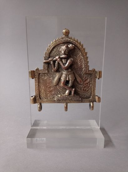 null Bronze votive plaque with high copper content, showing Krishna standing in a...