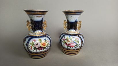 BAYEUX

Two ovoid porcelain vases with handles...