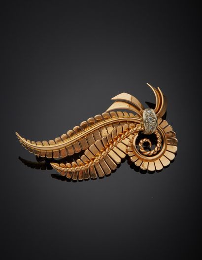 Two-tone 18K gold 750‰ brooch, adorned with...