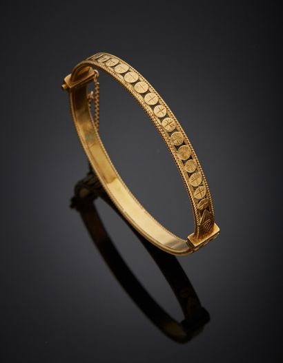 Bracelet jonc en or jaune 18K 750‰, à décor...
