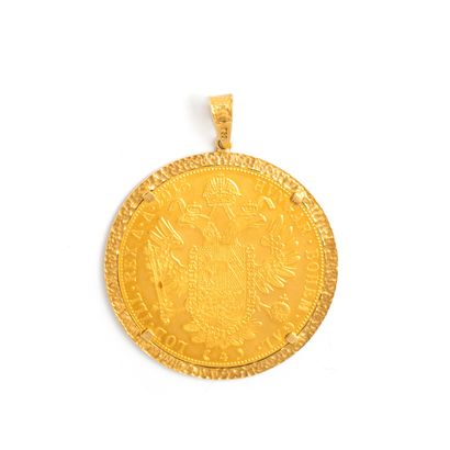 null 18K yellow gold 750‰ pendant consisting of an Austrian ducat.
Wear consistent...