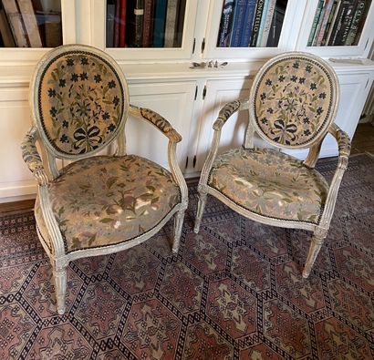 null Pair of armchairs in grey relacquered wood. Armrests with sleeves ending in...