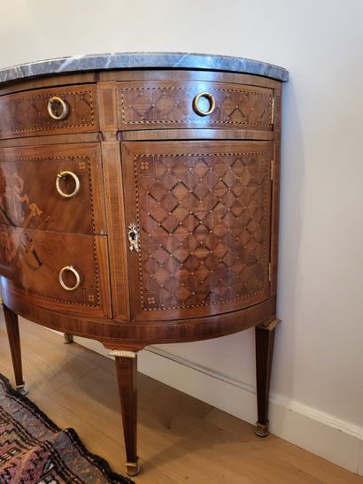 null Half-moon chest of drawers in veneer decorated with a music trophy. It opens...