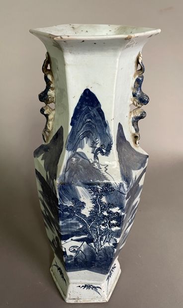 null Hexagonal stoneware vase decorated in blue underglaze with characters including...
