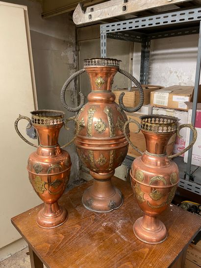 null A pair of vases and a vase in copper and brass in the North African taste.
H....