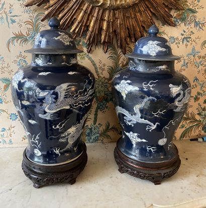 null Two covered porcelain potiches with blue background. 
CHINA
H. 49 cm 
Accidents,...