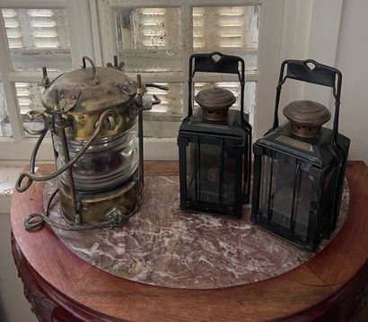 null Marine lamp in brass and two lanterns in black lacquered metal marked Béziers.
H....