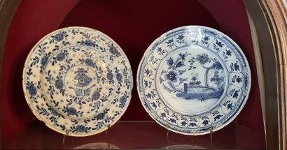 null Two small dishes in blue enamelled earthenware on a white background decorated...