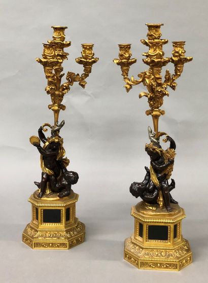 null Pair of five-light candelabra in gilt and chased bronze and bronze with brown...