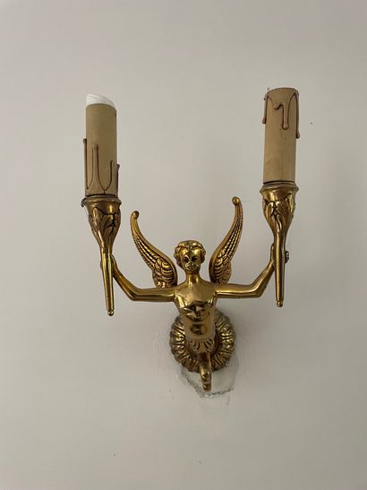 null A pair of gilt bronze chandeliers and sconces with six lights and cherubs.
H....