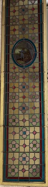 null Two doors decorated with stained glass windows with characters in the 18th century...