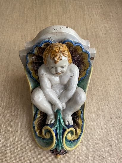 null Wall console in polychrome faience in the Renaissance taste showing a child...