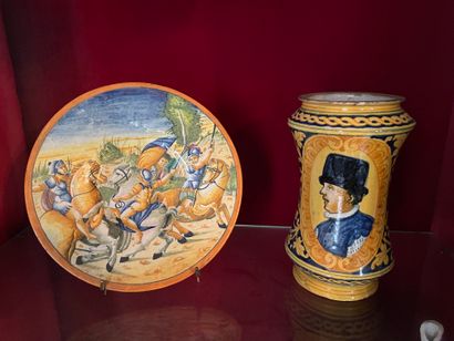 null An albarello and a decorative plate in polychrome earthenware decorated for...