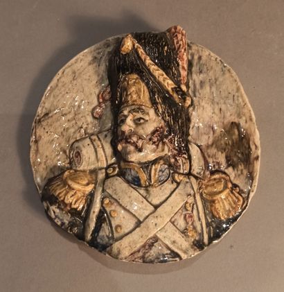 null TOURS 
Medallion representing a grognard in uniform in relief. Polychrome decoration...