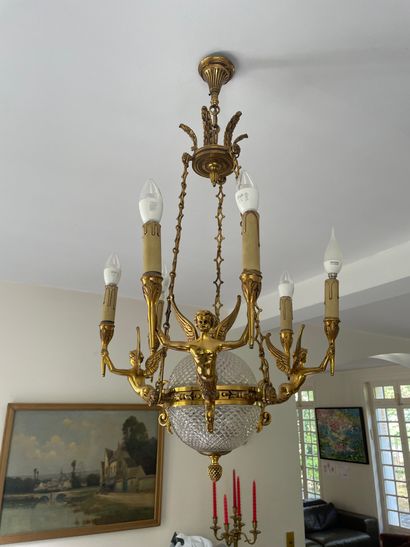 null A pair of gilt bronze chandeliers and sconces with six lights and cherubs.
H....