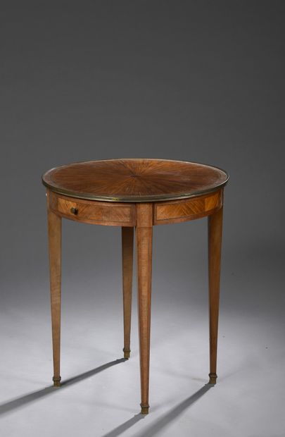 null Pedestal table in veneer with a radiating marquetry top opening to two drawers....