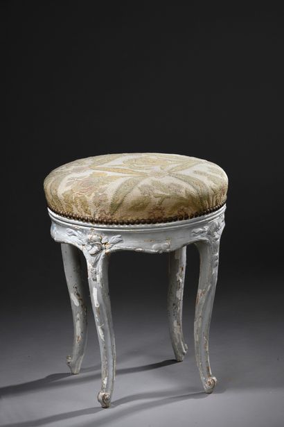null Round piano stool in relacquered wood and carved with flowers.
Seat upholstered...