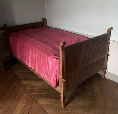 null Bed with uprights in oak carved with flutes, gadroons, rosettes and Greek.
Louis...