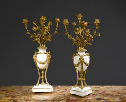 null Pair of candelabras in white marble and gilt bronze with bunches of four lights...