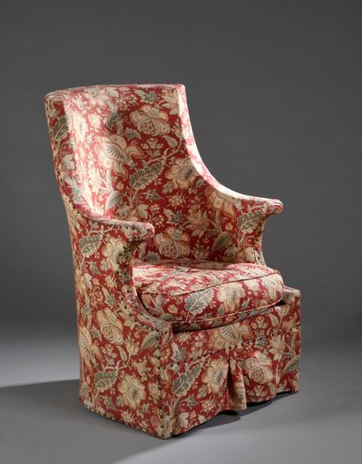 null Armchair with cabriolet back upholstered with a red fabric with floral decoration.
19th...