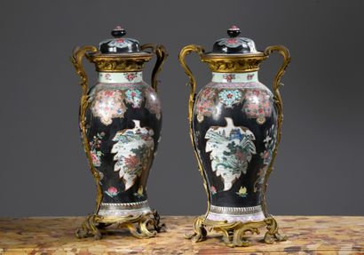 null CHINA - YONGZHENG period (1723 - 1735)
Pair of covered porcelain baluster vases...