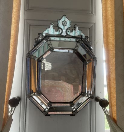 null Octagonal Venetian mirror with pediment and glass screens with engraved moldings.
In...