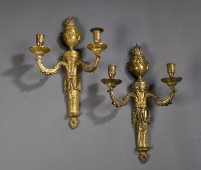 null Pair of ormolu sconces with two foliated arms decorated with fluted and filleted...