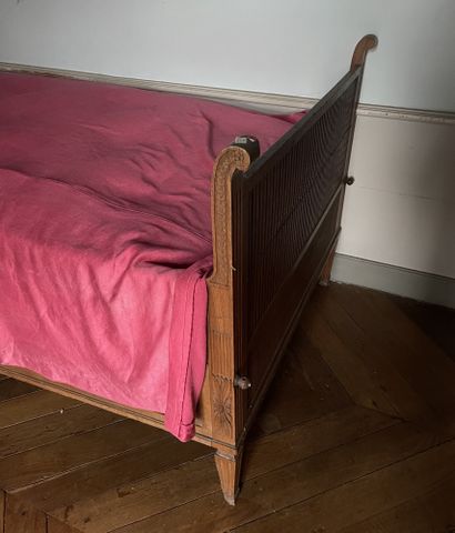 null Bed with uprights in oak carved with flutes, gadroons, rosettes and Greek.
Louis...