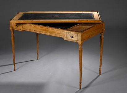 null Walnut and walnut veneer tric-trac table with two drawers. 
Tapered legs with...