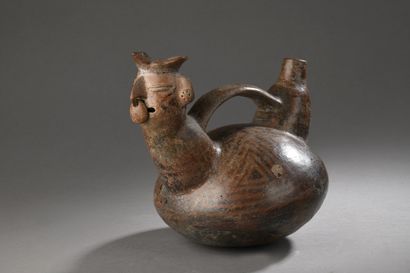 null Ceremonial anthropomorphic vase.
Composed of a double neck connected by a handle,...