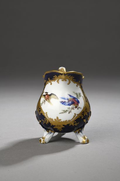 null SEVRES
Three-legged milk jug in soft porcelain with polychrome decoration of...