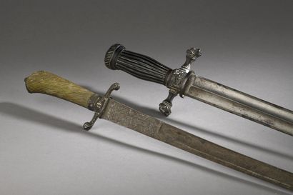 null TWO HUNTING GUNS without scabbard.
One 18th century with silver guard, engraved...