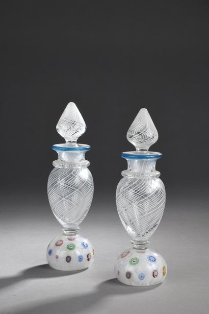 null SAINT-LOUIS
TWO BALUSTERED BOTTLES ON PAPERWEIGHERS, signed and dated SL 1985,...