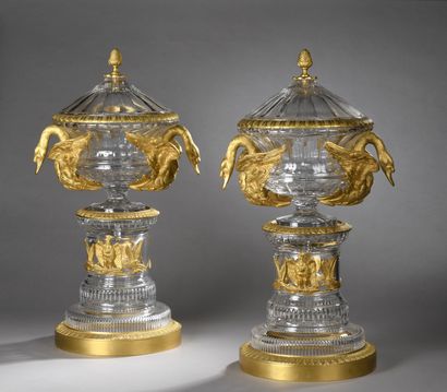 null PAIR OF MEDICIS VASES covered in cut crystal, on a column base with rich ormolu...