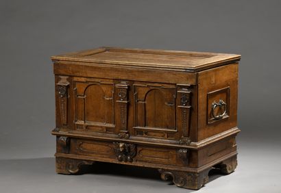 null LITTLE walnut chest with an architectural facade punctuated by three pilasters....
