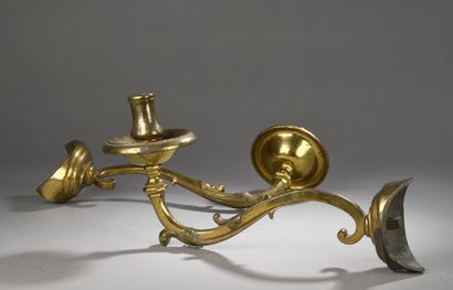 null Pair of gilded bronze corner sconces with a sinuous foliated arm of light and...