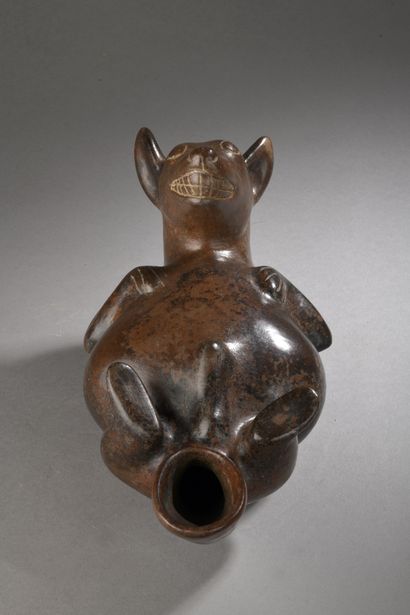 null CEREMONIAL VASE representing a dog.
Lying on its back and paws in the air, it...