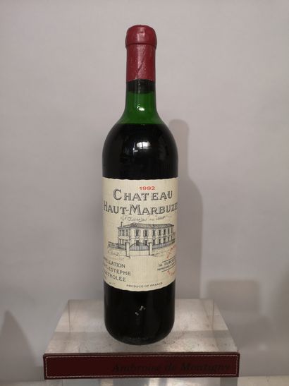 null 1 bouteille Château HAUT MARBUZET 1992 - Saint Estèphe 
Niveau mi épaule.