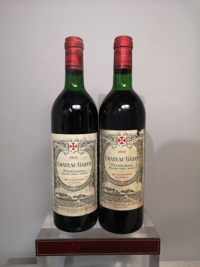 null 2 bouteilles Château GAZIN - Pomerol 1983 et 1986 
Étiquettes légèrement tachées...