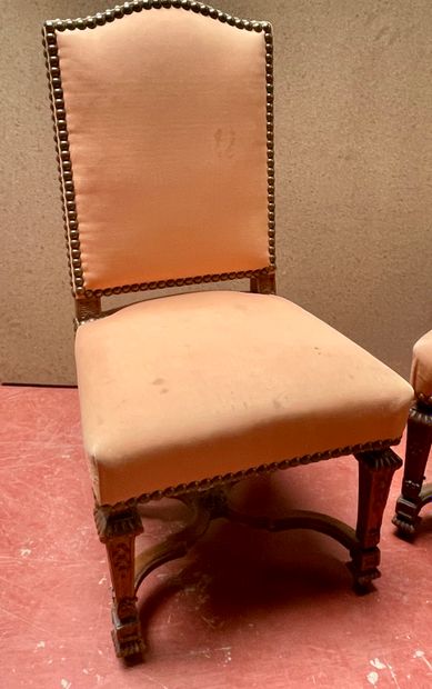 null Pair of chairs in molded and carved wood, X brace, sheath legs, pink background...