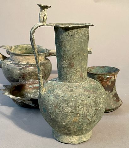 null Lot including 4 pieces:
-BRONZE POURER AND BASIN 
Seljuk Iran, 12th-13th century
Vase...