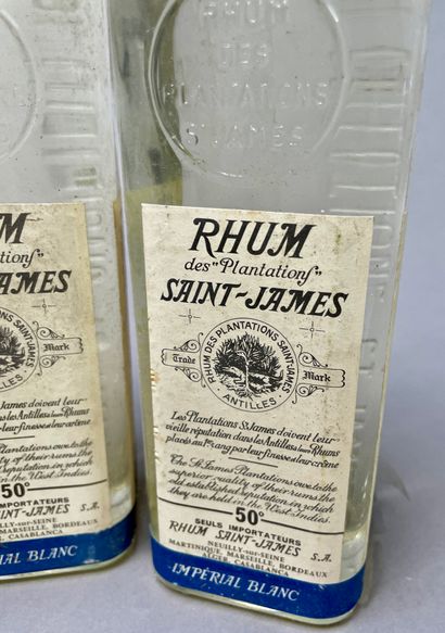 null 3 bottles of RHUM Saint James "Imperial Blanc
50's - 60's. Blue cap. In the...