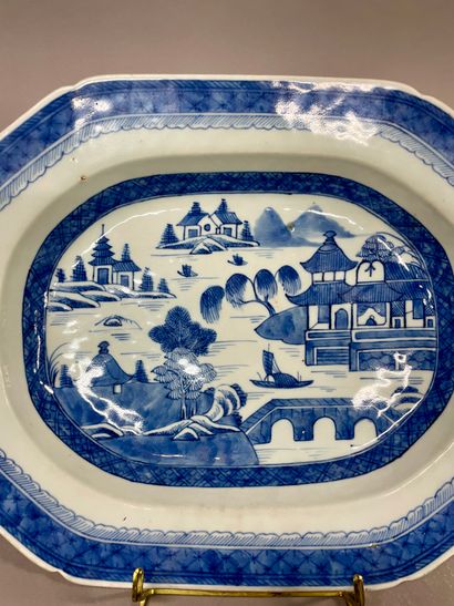 null China
Rectangular dish with cut sides, decorated in blue with a lake landscape...