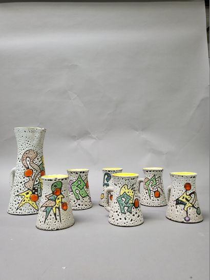 null MARIUS BESSONE (XXth) 
Six mugs and a pitcher in polychrome enamelled ceramics...