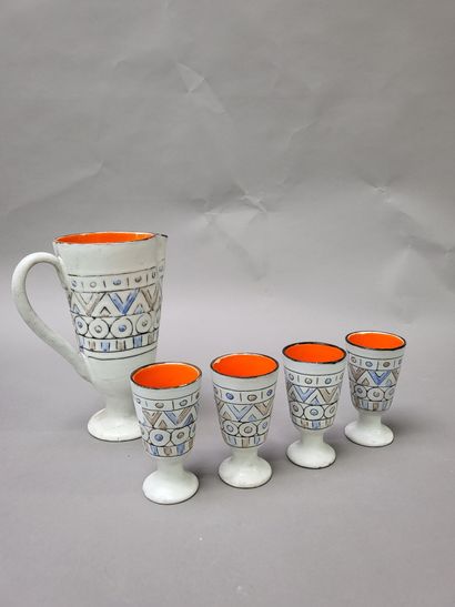 null ALAIN MAUNIER (XXth) 
A pitcher and four goblets on foot in polychrome enamelled...
