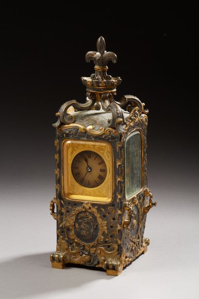 null Brass clock, in the shape of a sedan chair, decorated with gilding and black...